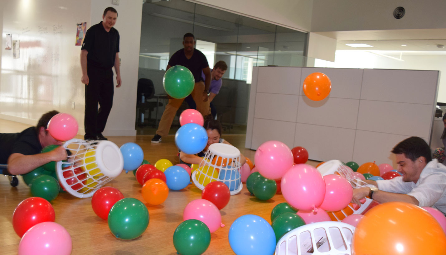 Page employees take a lunch break to recreate an all-time favorite board game. - Kelsey Flynn