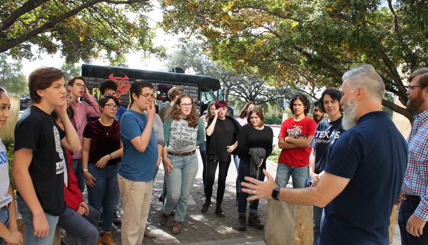 Page Associate Principal Brandon Townsend welcomed students outside the Page office. - 