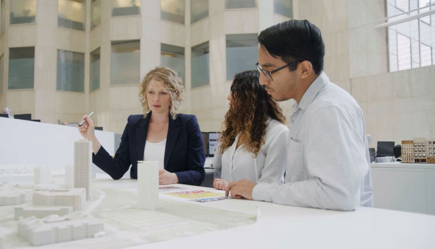 Page sustainability thought leader Jill Kurtz explains an element of energy modeling to colleagues Carolina Pastor and Edward Hidrogo. - Autodesk