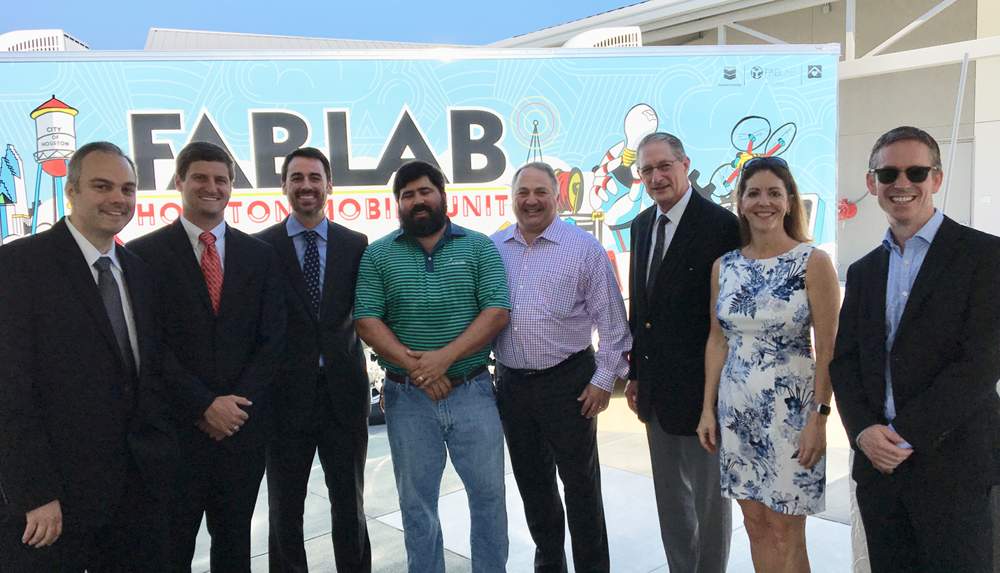 Proud members of the Page team flank project partners at the grand opening of the new BakerRipley Fab Lab in East Aldine. - BakerRipley