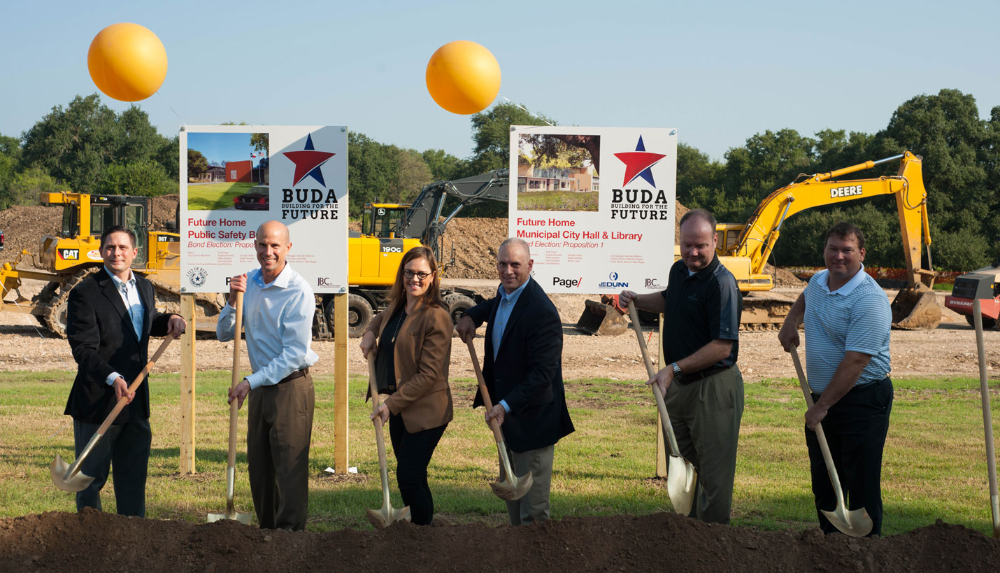 Page Project Manager Ginny Chilton and Principal Jonathan Sylvie are pictured in center with colleagues from JE Dunn Construction. - 