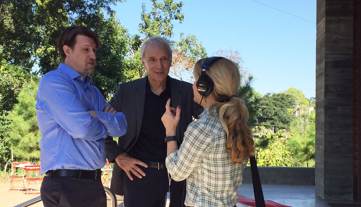 Scott McCready of SWA (left) and Page Senior Principal Larry Speck (right) discuss landscape and architectural design respectively with local media. - Page