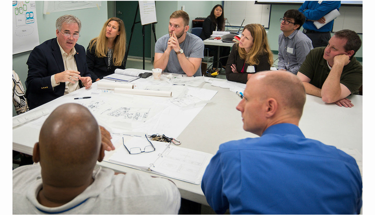 Members of the Page project team listen to a discussion about the new High School for Law and Justice. - Houston ISD/Dave Einsel